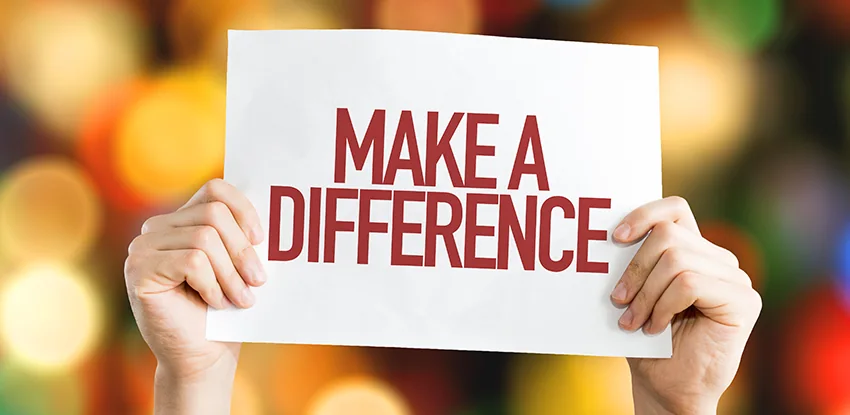 Hands holding a Make a Difference sign